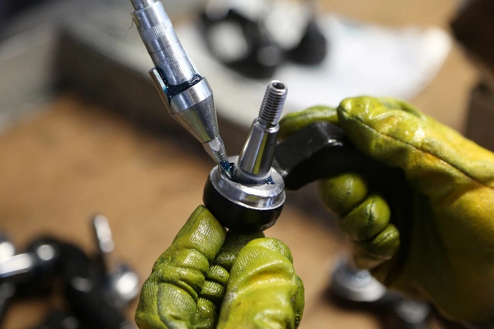 Workshop - mechanic changing wheel